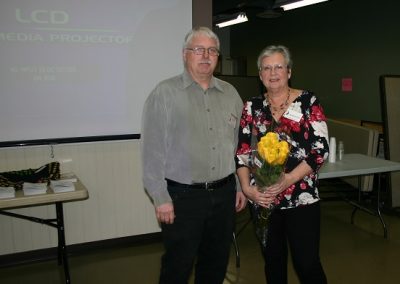 John presenting flowers to Peggy