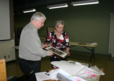 John presenting gifts to Peggy