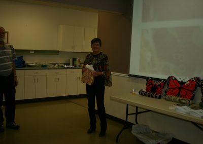 Denny presenting gifts to Shirley